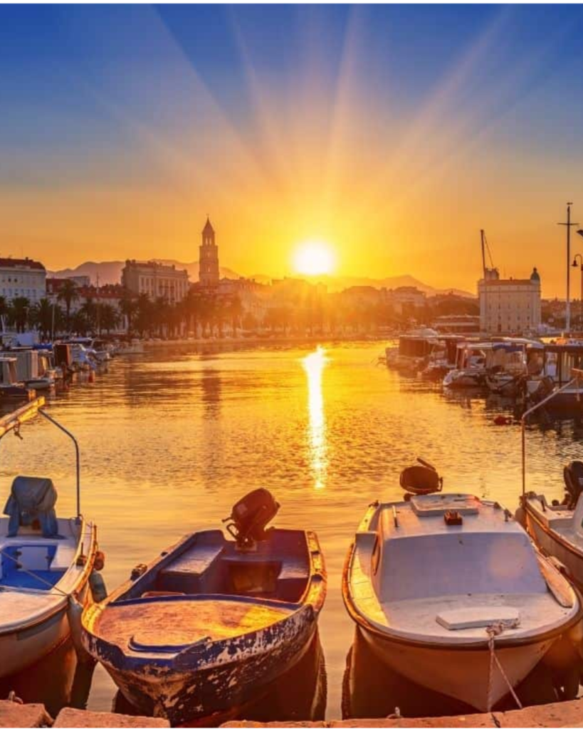 Sunset over Split harbor with traditional fishing boats, Croatia