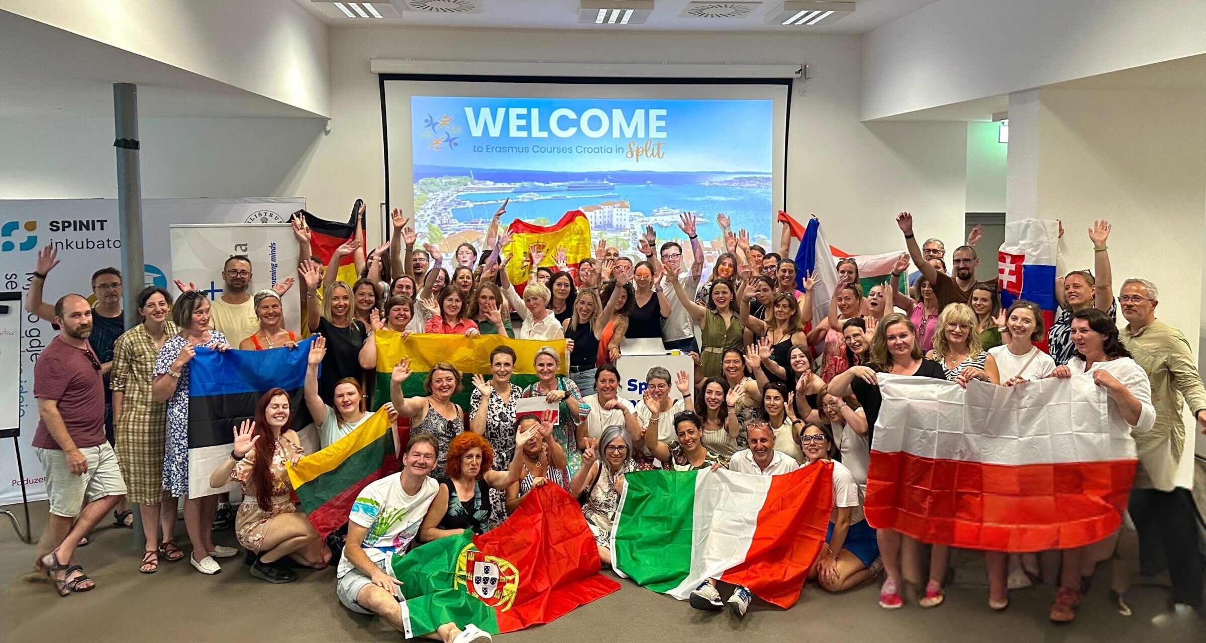 International teachers group holding national flags at an Erasmus Courses Croatia training program in Split, Croatia